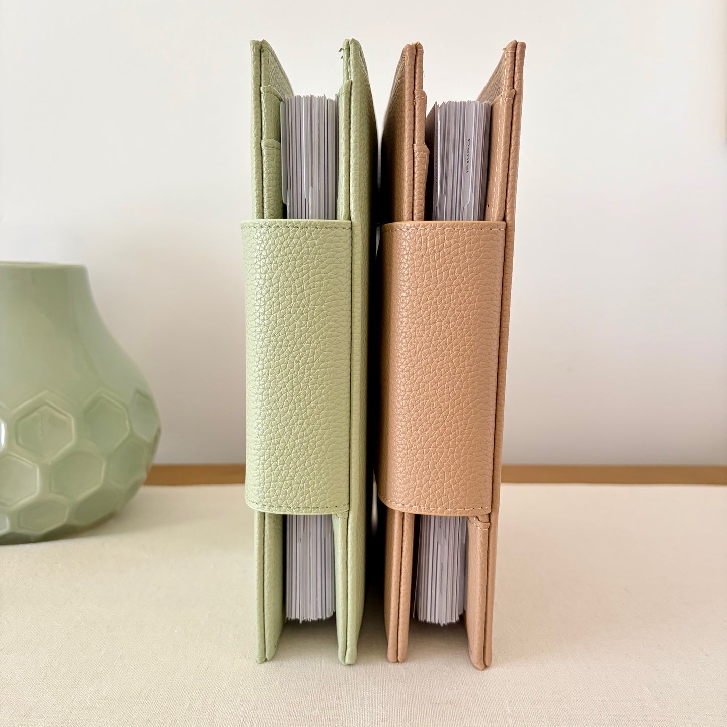 Sage and Latte colours standing up next to each other